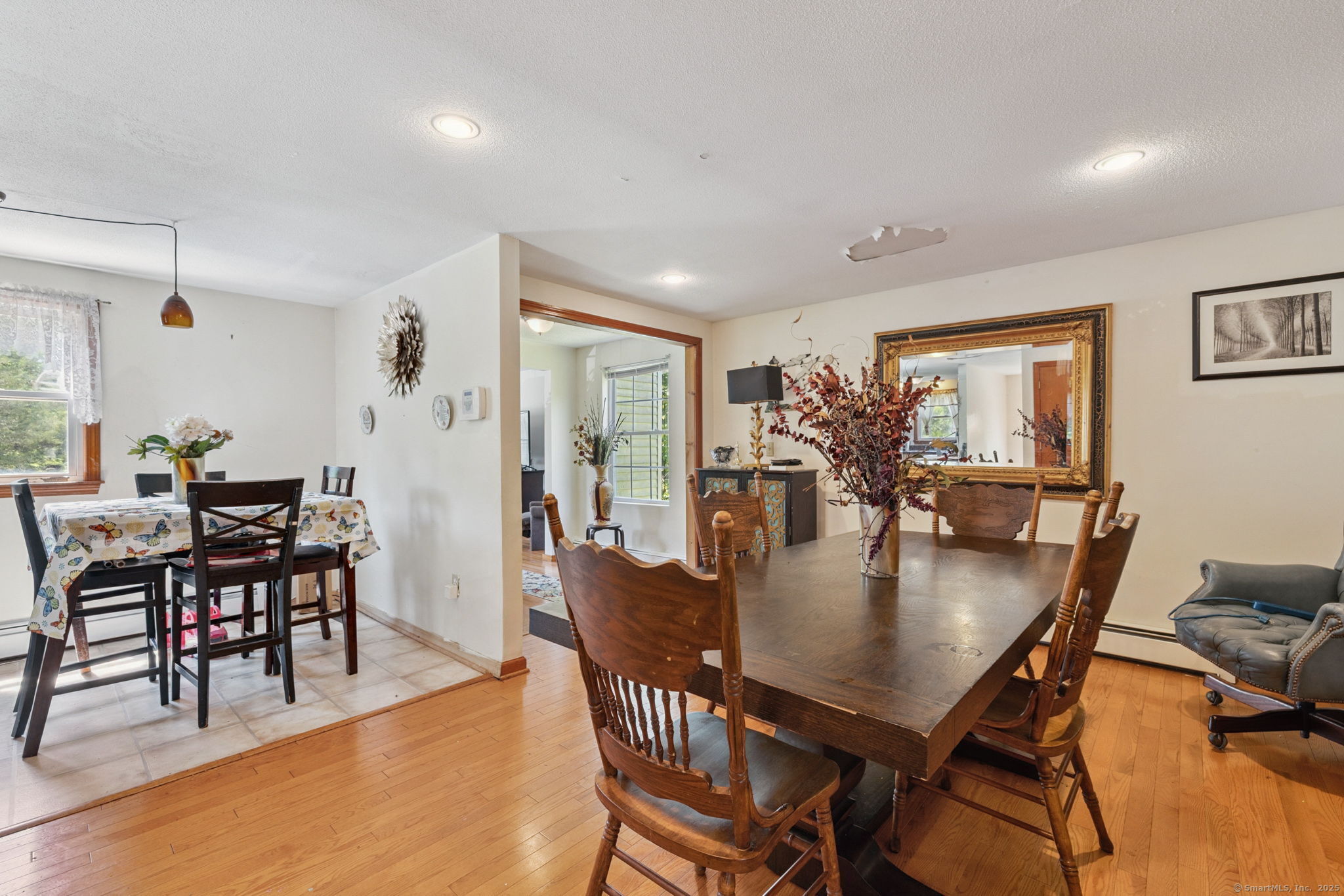 2 Sandra Drive Bloomfield, CT 06002 - Photo 15 of 32 a dining room with furniture and wooden floor