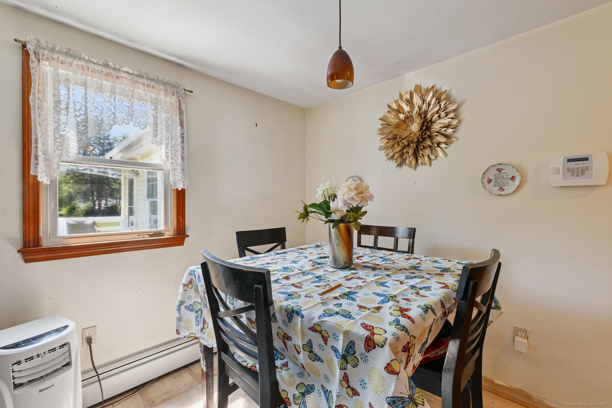 2 Sandra Drive Bloomfield, CT 06002 - Photo 21 of 32 a view of a dining room with furniture and wooden floor
