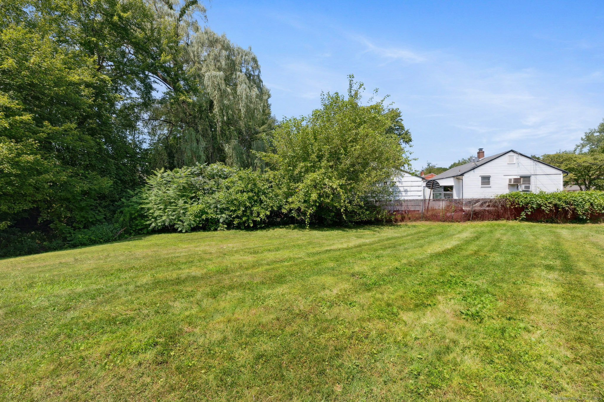 2 Sandra Drive Bloomfield, CT 06002 - Photo 3 of 32 a view of a big yard with potted plants and large tree