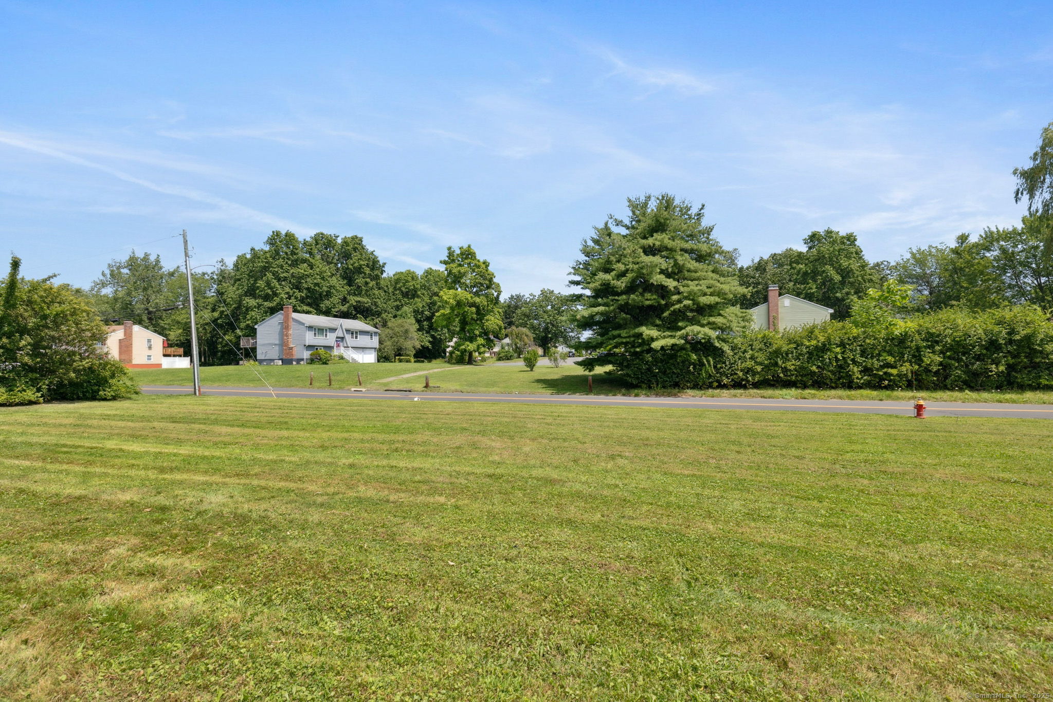 2 Sandra Drive Bloomfield, CT 06002 - Photo 7 of 32 a view of a big yard with a large trees