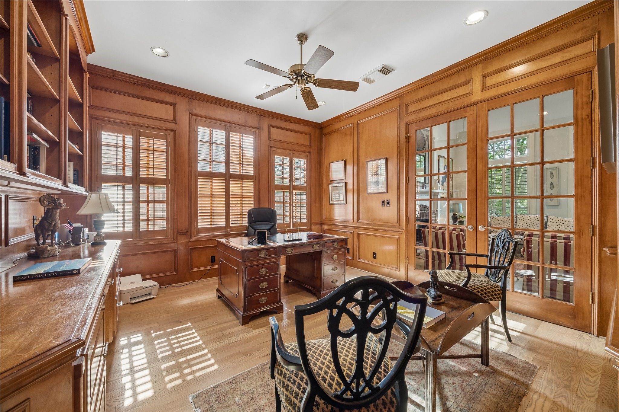 11421 Whippoorwill Road Houston, TX 77024 - Photo 12 of 33 A first floor wood paneled study between the living room and primary suite complete with plenty of built-ins.