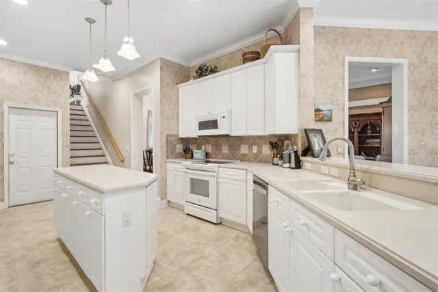 a front view of a house with a yard and a garage