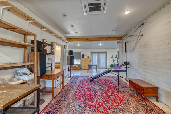 a living room with furniture and a rug