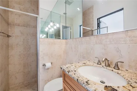 a bathroom with a sink and mirror