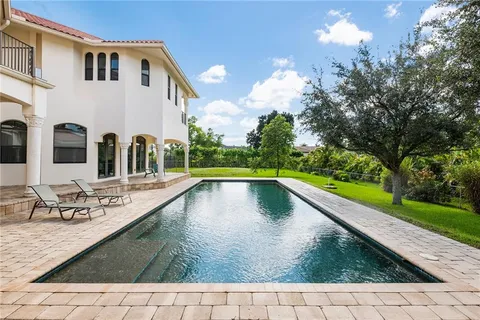 a view of swimming pool with a patio