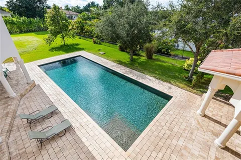 a view of a house with a swimming pool