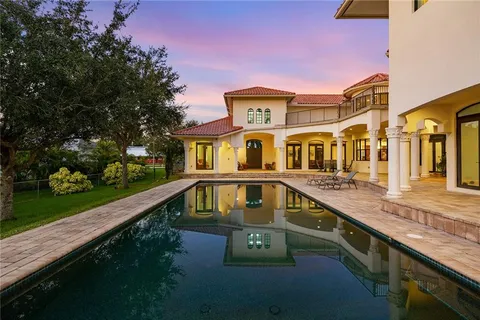 a front view of a house with swimming pool