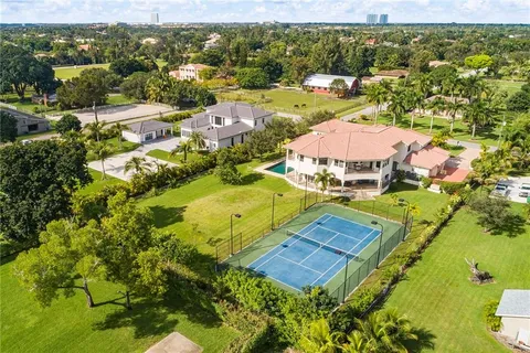 an aerial view of residential houses with outdoor space