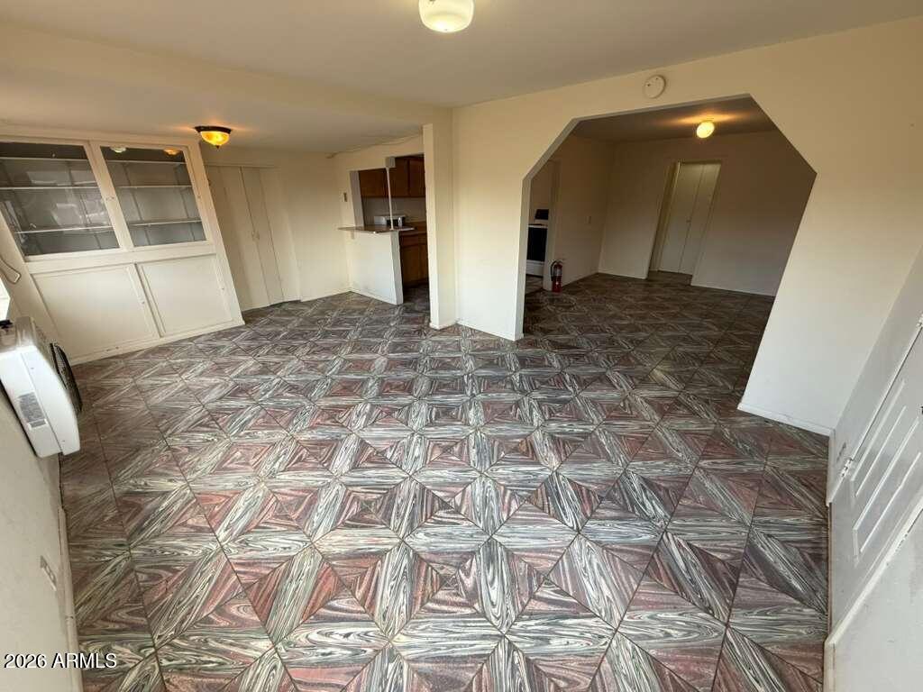 1365 East 20th Street Douglas, AZ 85607 - Photo 2 of 15 a view of a livingroom with wooden floor and electronic appliances