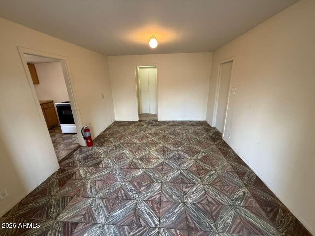 1365 East 20th Street Douglas, AZ 85607 - Photo 4 of 15 a bedroom with a bed and a flat screen tv