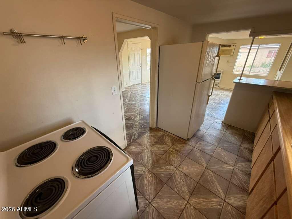 1365 East 20th Street Douglas, AZ 85607 - Photo 6 of 15 a view of a storage and utility room with washer and dryer
