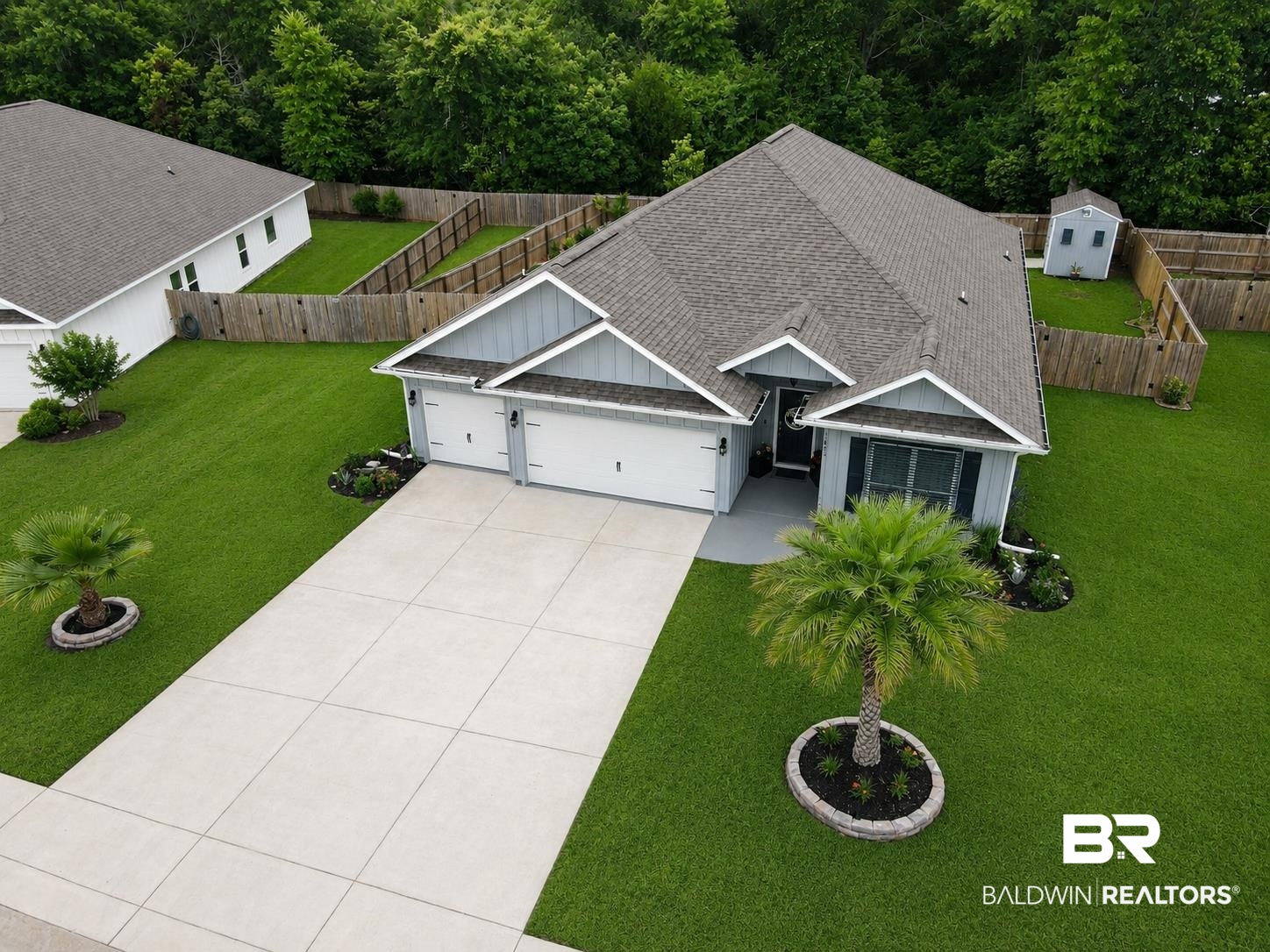 1885 Carly Street Foley, AL 36535 - Photo 37 of 40 Contemporary single-story residence featuring a two-car garage, a wide concrete driveway, and a well-maintained lawn