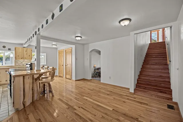 a view of a dining room with furniture and wooden floor