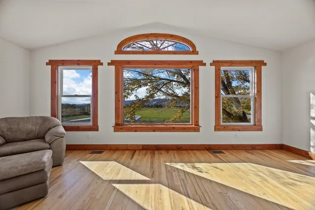 a living room with a couch and a window