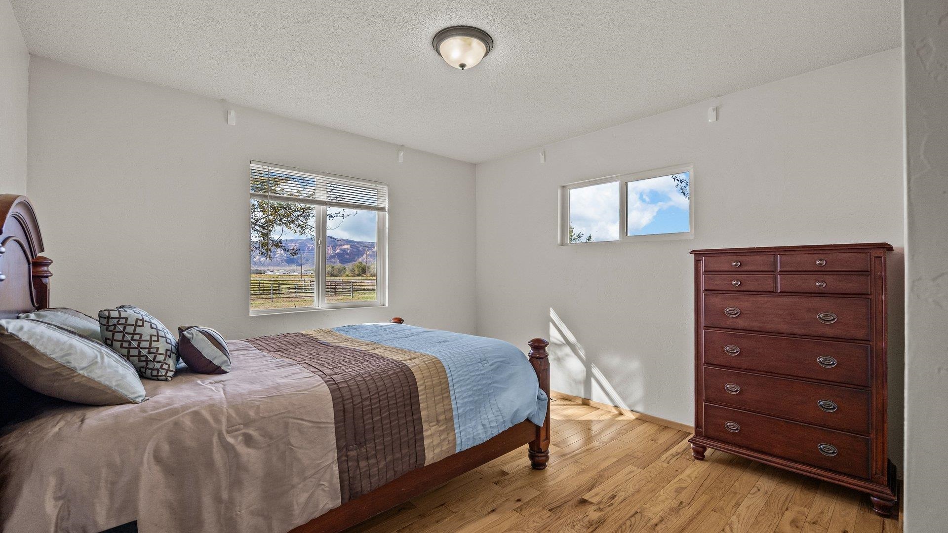 1903 J Road Fruita, CO 81521 - Photo 24 of 35 a bedroom with a bed and a window