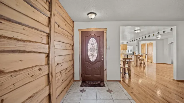a view of entryway with wooden floor