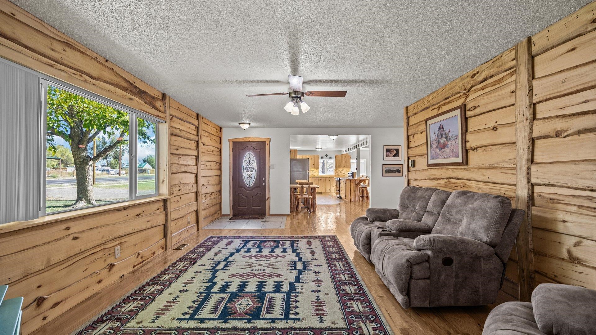 1903 J Road Fruita, CO 81521 - Photo 8 of 35 a living room with furniture and a fireplace