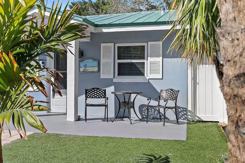 724 Gulf Boulevard Indian Rocks Beach, FL 33785 - Photo 13 of 55 a view of a backyard with a patio and plants