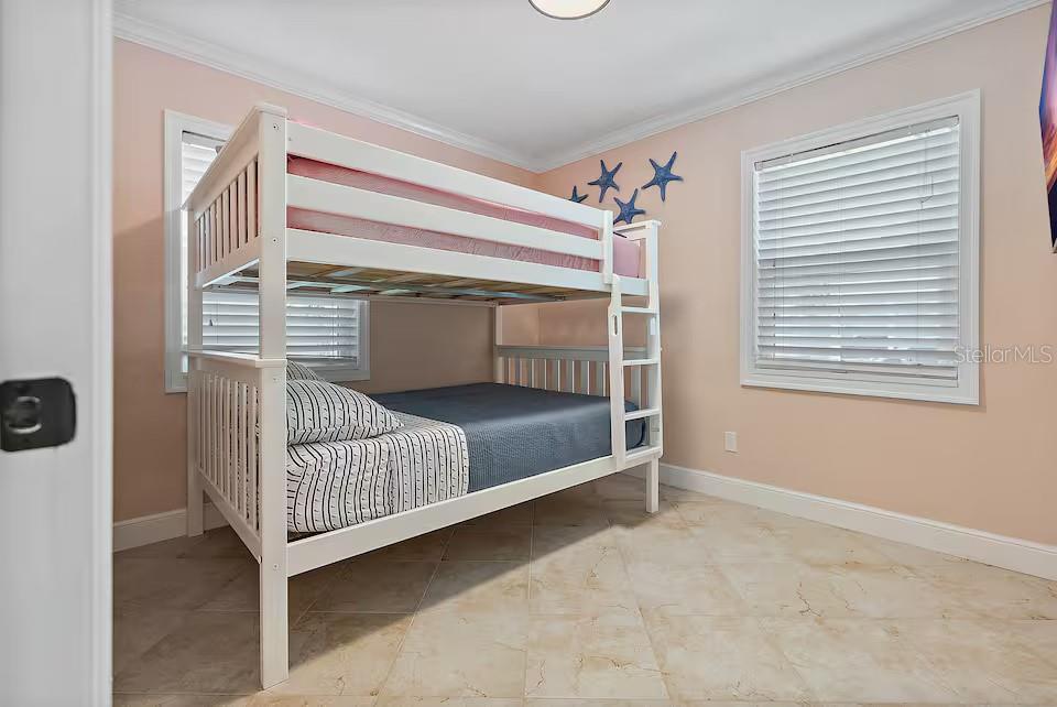 724 Gulf Boulevard Indian Rocks Beach, FL 33785 - Photo 22 of 55 a bedroom with a bed and a window
