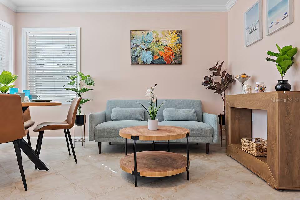724 Gulf Boulevard Indian Rocks Beach, FL 33785 - Photo 25 of 55 a living room with furniture and a potted plant