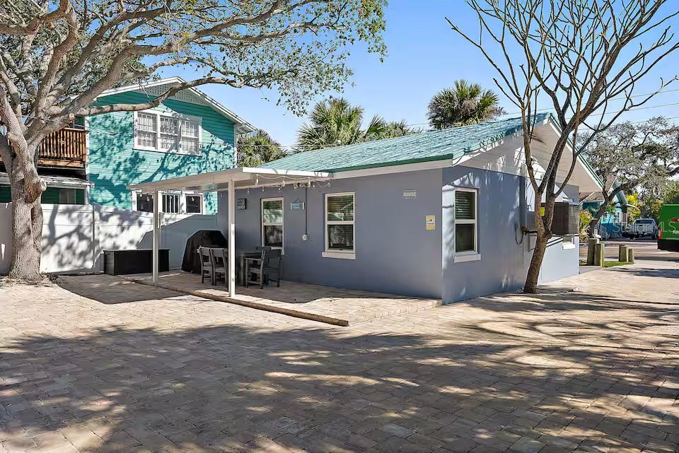 724 Gulf Boulevard Indian Rocks Beach, FL 33785 - Photo 3 of 55 a front view of house with yard