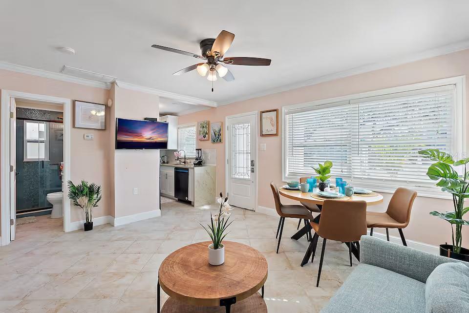 724 Gulf Boulevard Indian Rocks Beach, FL 33785 - Photo 31 of 55 a living room with furniture and a potted plant