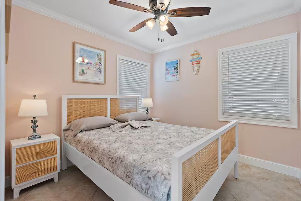 724 Gulf Boulevard Indian Rocks Beach, FL 33785 - Photo 33 of 55 a bedroom with a bed and a window