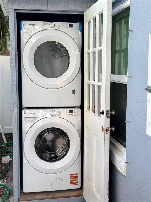 724 Gulf Boulevard Indian Rocks Beach, FL 33785 - Photo 38 of 55 a utility room with dryer and washer