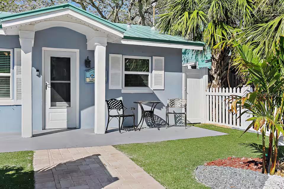 724 Gulf Boulevard Indian Rocks Beach, FL 33785 - Photo 4 of 55 a view of a house with backyard and sitting area