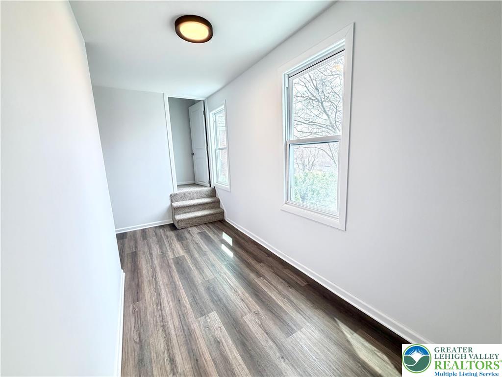 752 2nd Street Catasauqua, PA 18032 - Photo 15 of 23 a view of a livingroom with wooden floor and window