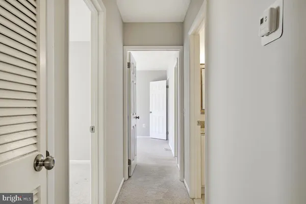 a view of a hallway with a shower