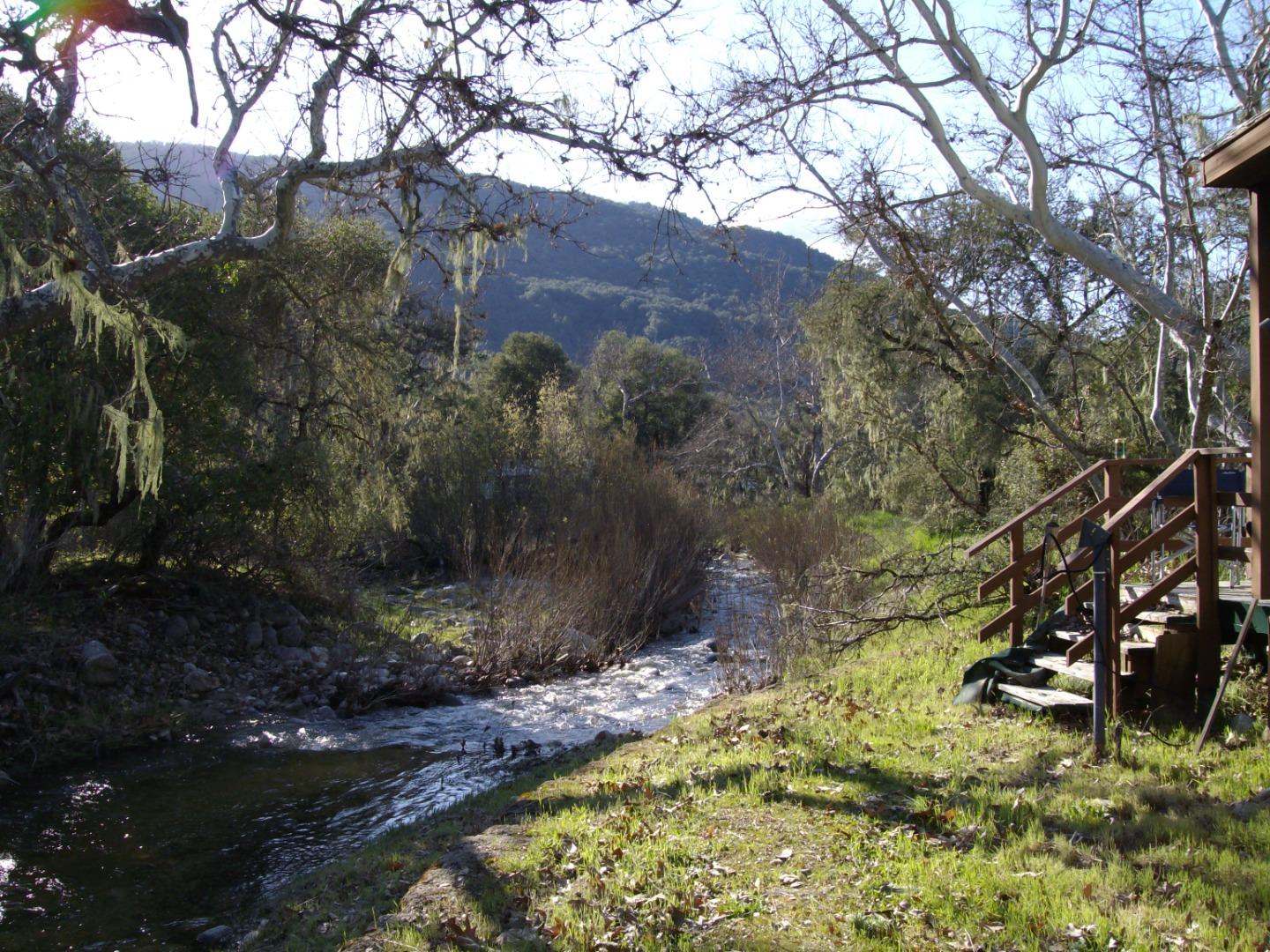 18671 Cachagua Road Carmel Valley, CA 93924 - Photo 2 of 6 a view of a wooden bridge with large trees
