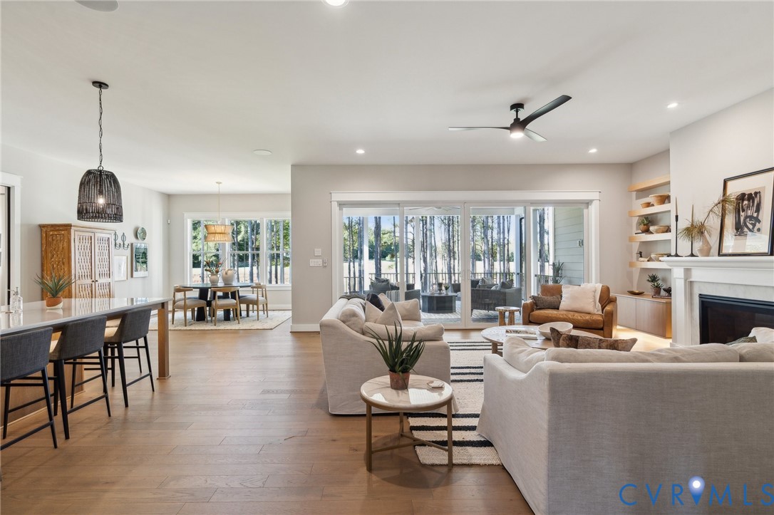 4976 Gooden Trail Quinton, VA 23141 - Photo 11 of 49 a living room with furniture potted plant and a large window