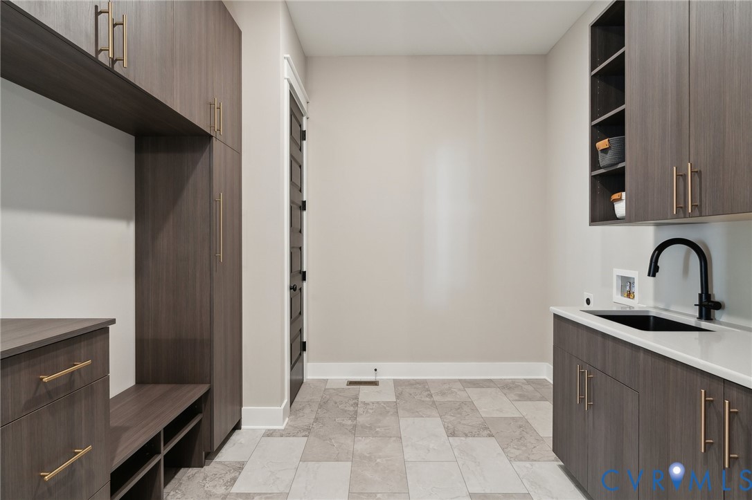 4976 Gooden Trail Quinton, VA 23141 - Photo 43 of 49 a kitchen with a sink and cabinets