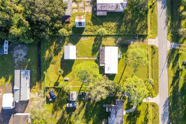 a living room with furniture a bed and a window