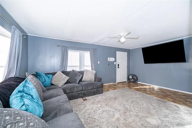 a kitchen with granite countertop wooden floors a stove and a sink
