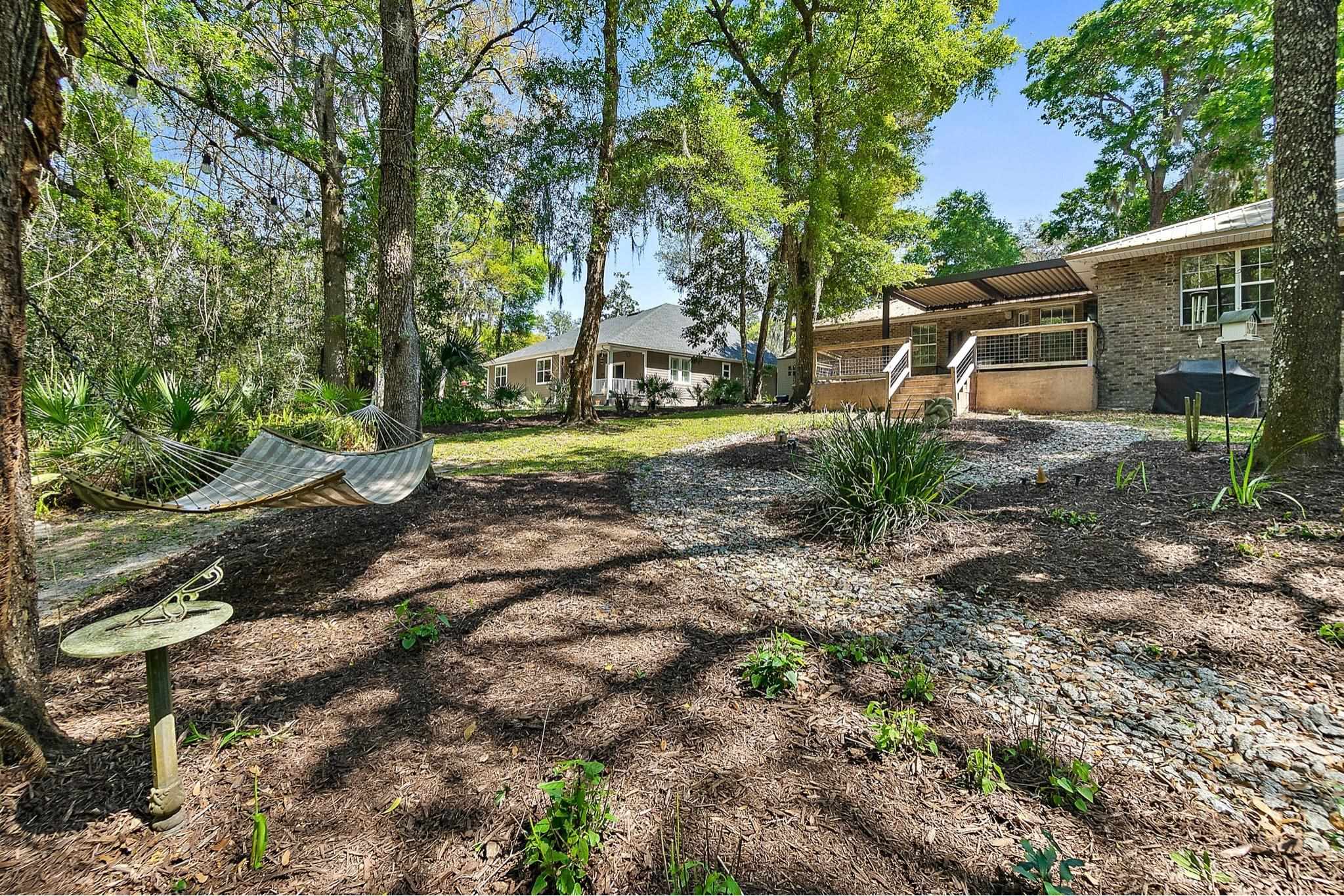 3253 Turtle Creek Road St. Augustine, FL 32086 - Photo 35 of 40 a front view of a house with garden