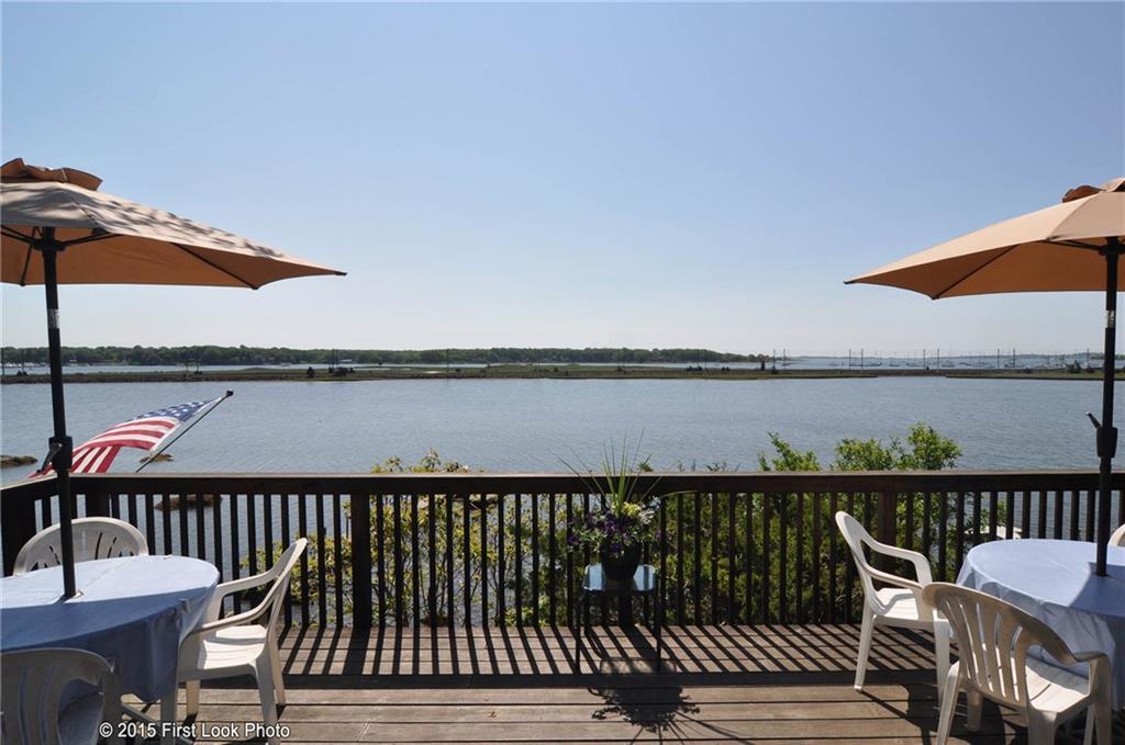 210 Cedar Road Groton, CT 06355 - Photo 1 of 1 a view of a balcony with wooden floor and outdoor seating