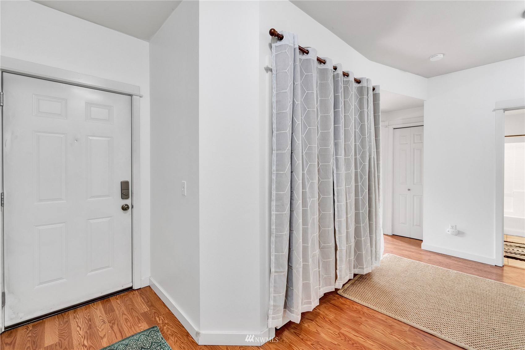 2009 196th Street Southeast, Unit C201 Bothell, WA 98012 - Photo 3 of 36 a view of a room with wooden floor and entryway