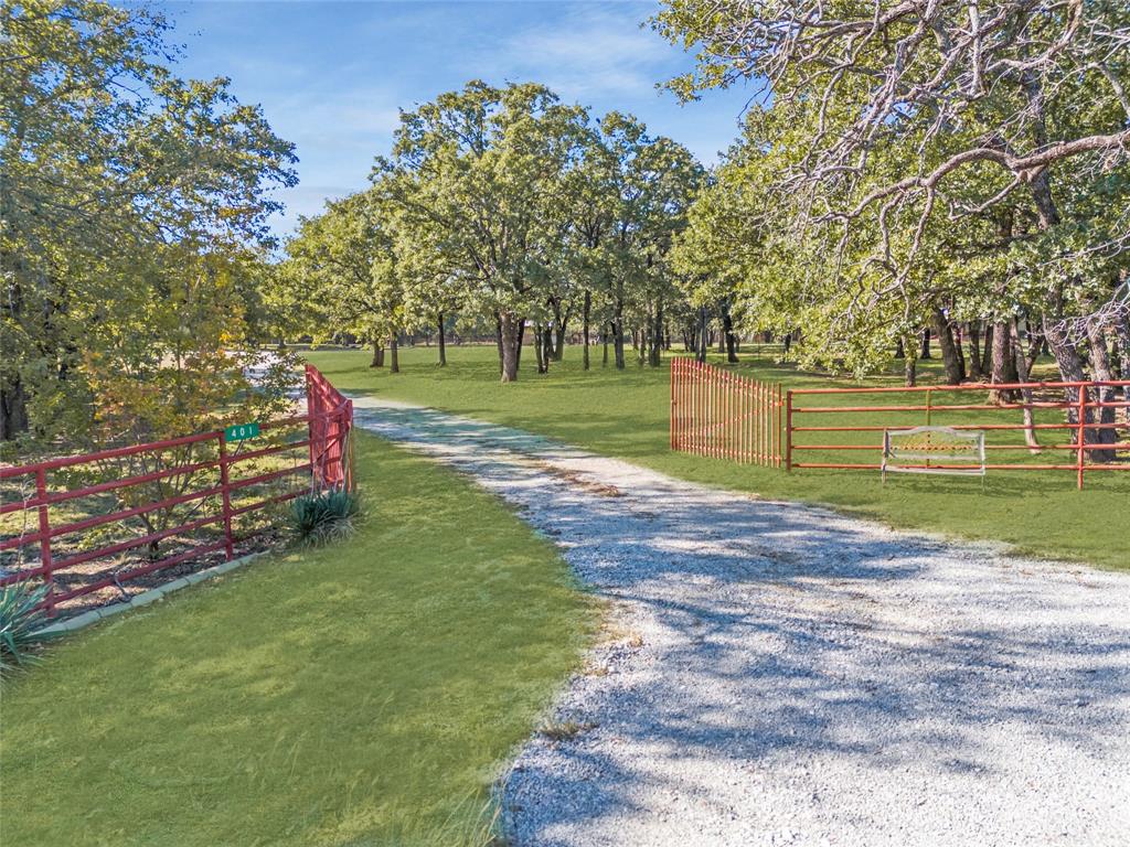 401 North Hemming Road Valley View, TX 76272 - Photo 1 of 1 a green field with lots of trees in the background