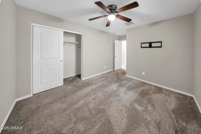 a view of a big room with carpet