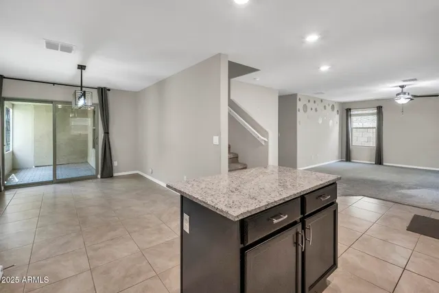 a kitchen with a sink a counter space and appliances