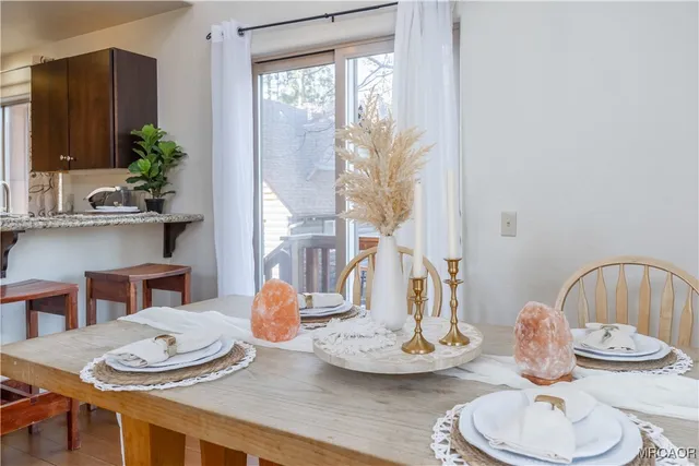 a kitchen with dining table and chairs
