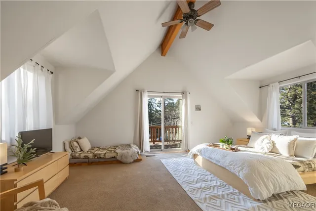 a bedroom with furniture and a window