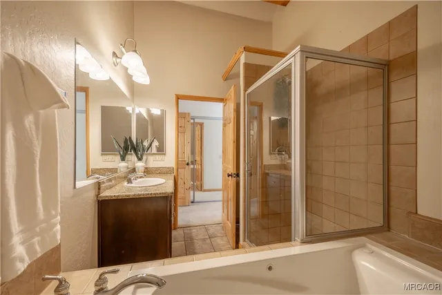 a bathroom with a shower and a sink