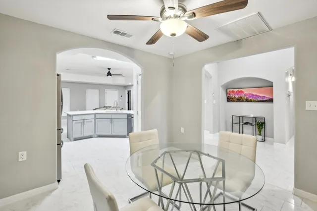 a kitchen with cabinets stainless steel appliances and a counter space
