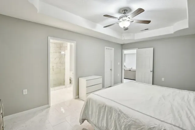 a bathroom with a bathtub and a toilet