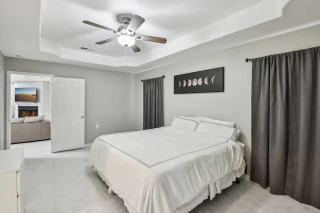 a bathroom with a double vanity sink a toilet and shower