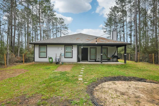 a backyard of a house with seating space