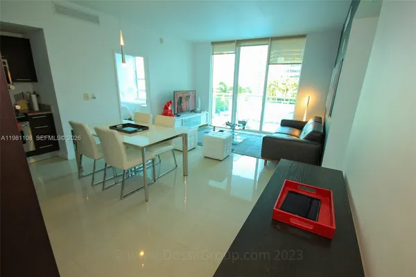 a workspace with furniture window and wooden floor